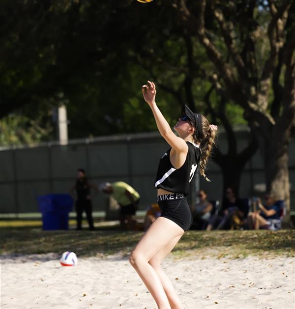 Beach Volleyball player getting ready to hit the ball